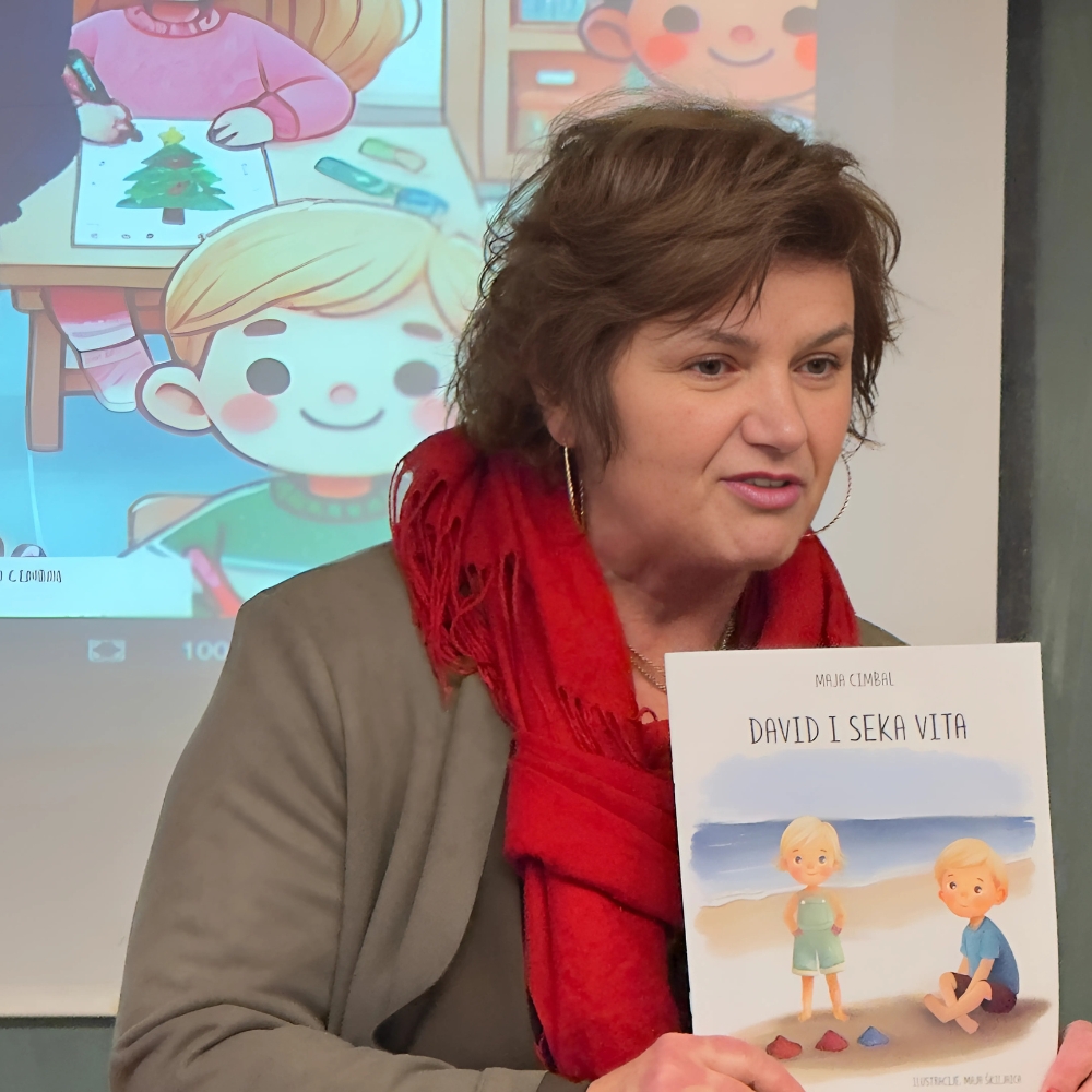 Maja Cimbal čita priče učenicima u OŠ Vjenceslava Novaka, uz izradu božićnih čestitki.